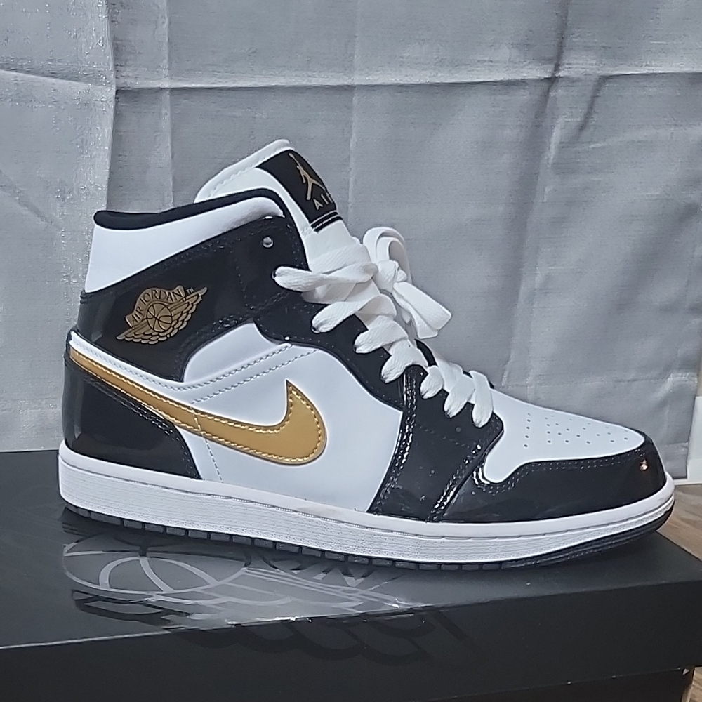 Jordan Black and Gold Sneakers